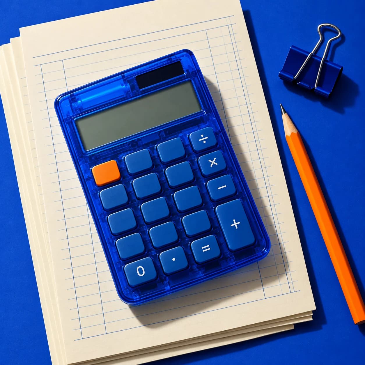 Blue calculator and orange pencil arranged on a cobalt backdrop